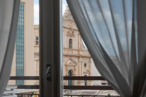 Central House palazzo Brafa una camera di albergo, Ispica