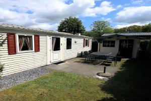 Charmante woning op rustig park met fietsen Guest house, Epe