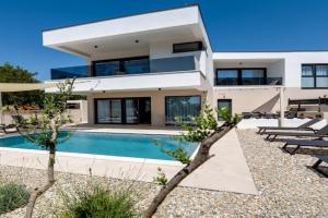 Villa Mirakul, new modern villa with swimming pool, close to the beach, children playroom, quiet area- by TRAVELER tourist agency Krk - ID 2680, Omisalj
