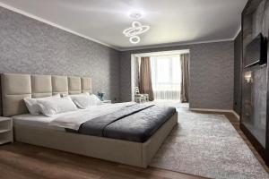 Zamechatelnaya Raimbek rezidens 20-63 & pitevaya voda podarok Apartments, Almaty