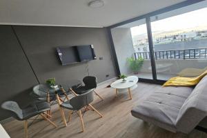Alojamiento a pasos de Movistar Arenas, Universisdad de Chile y Parque O Higgins Apartments, Santiago
