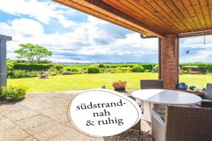 Huus Binnensee - Erdgeschoss-Wohnung mit Garten & Seeblick - Wintergarten & Terrasse - hundefreundlich - ruhige Lage - Südstrand 5 Min mit Rad, Burg auf Fehmarn