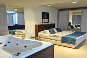 Luxury Suite with Jacuzzi on the beach by Almog Beach Apartments, Haifa