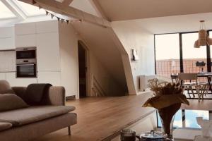 Lichtrijke loft bij restaurant Den Olifant Apartments, Ieper