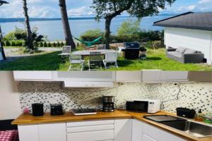 Nice Apartment with1 bedroom Separate living room with a sofa bed and a tiny kitchen a bathroom located in Nordstrand near by the Sea for 3 guests with a garden and grill with sea view just outside the apartment, Oslo