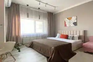 Uyutnaya studiya s vidom na Botanicheskiy park Apartments, Astana