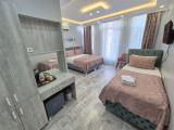 Deluxe Triple room with balcony and with city view