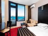 Standard Triple room with partial sea view