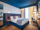 Comfort room with balcony and with garden view