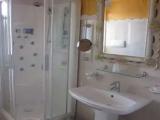 Standard Quadruple room with partial sea view