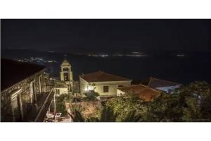 The Schoolmistress with the Golden Eyes, Studios & Rooms, Mithymna