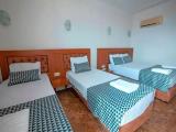 Standard Quadruple room with partial sea view