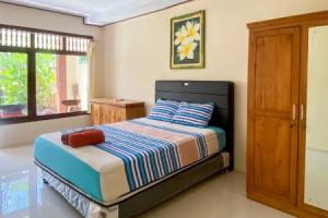 Raja Asri Guest House Sanur Mitra RedDoorz, Denpasar