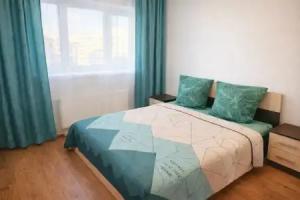 Uyutnye v Sovremennom ZhK Ryadom s Vyezdom iz Goroda Apartments, Tyumen