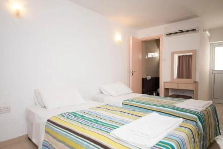 A. Maos Apartments - 107