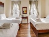 Deluxe Quadruple room with balcony
