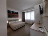 Standard Quadruple room with balcony and with partial sea view