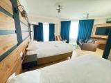 Deluxe Quadruple room with balcony