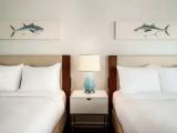 Deluxe Quadruple room with balcony and oceanfront