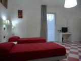 Standard Quadruple room with balcony and with garden view