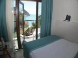 Standard Triple room with balcony and with partial sea view