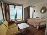 Comfort Basement Studio with balcony and with partial ocean view