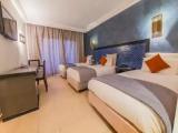 Standard Triple room with garden view