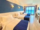 Deluxe Quadruple room with balcony and with sea view