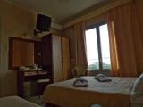 Standard Triple room with balcony and with partial sea view
