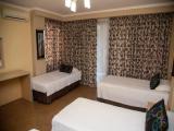 Standard Triple room with partial sea view