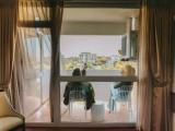 Deluxe room with balcony and with partial ocean view