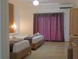 Standard Triple room with garden view