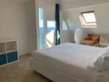 Apartment with balcony and beachfront