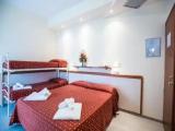 Classic Quadruple room with balcony and with partial sea view
