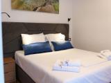 Standard Quadruple room with balcony and with partial ocean view