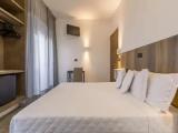 Standard Quadruple room with partial sea view