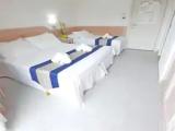 Standard Triple room with balcony and with partial sea view