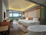 Standard Quadruple Club room with garden view