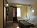 Standard Quadruple room with partial sea view