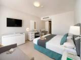 Standard Triple room with partial sea view