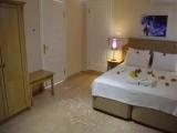 Standard Triple room with balcony and with partial sea view