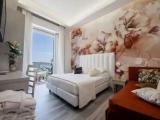 Deluxe Triple room with balcony and with sea view