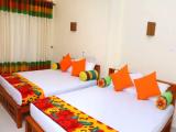 Deluxe Quadruple room with balcony and with garden view