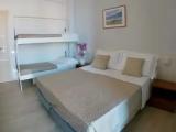 Standard Quadruple room with partial sea view