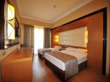Standard Quadruple room with balcony and with partial sea view