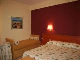 Standard Triple room with garden view