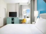 With Fridge room with partial ocean view