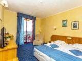 Standard Quadruple room with balcony and with partial ocean view