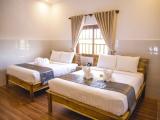 Standard Quadruple Family room with garden view