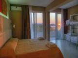 Standard Quadruple room with partial sea view